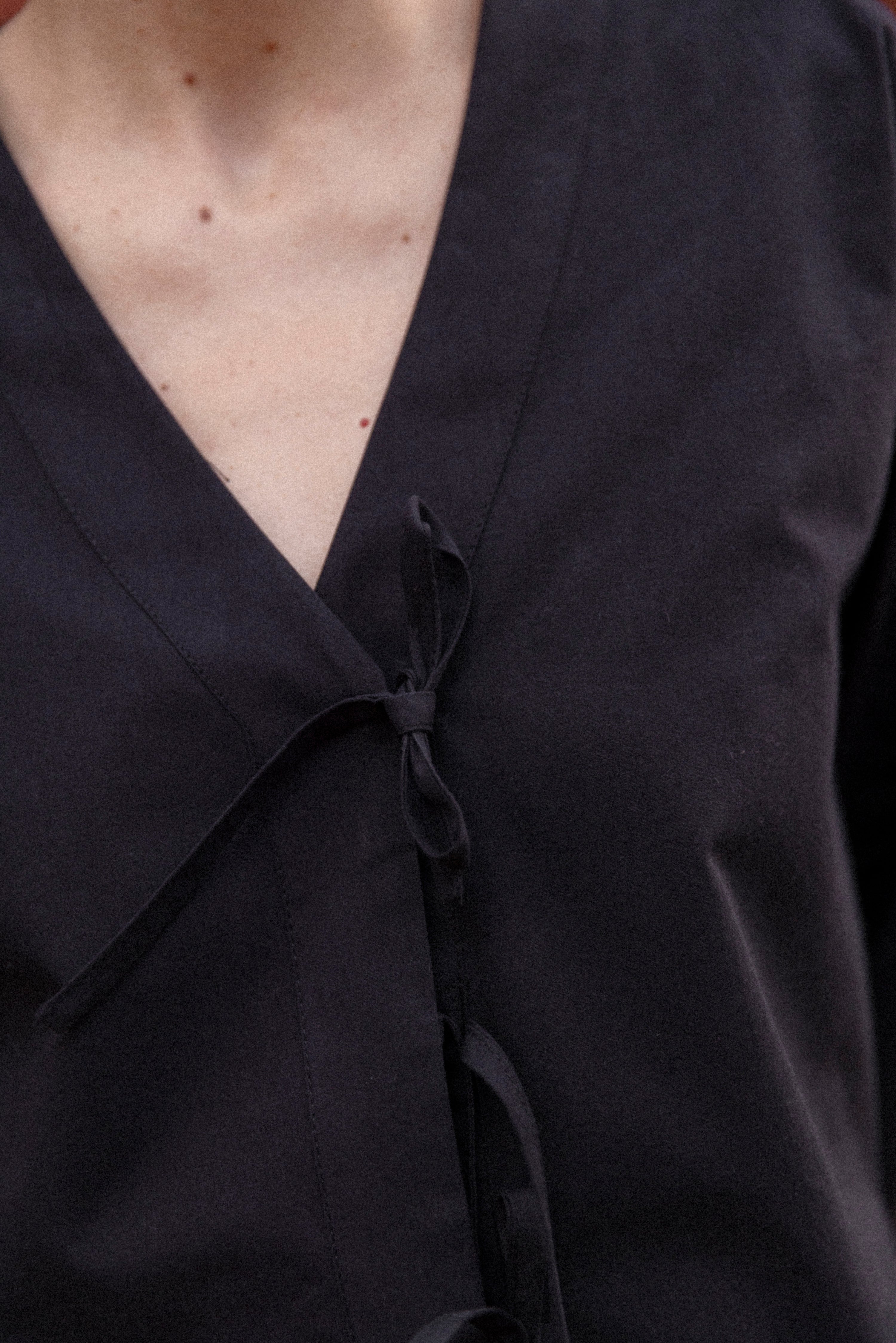 Black knotted blouse