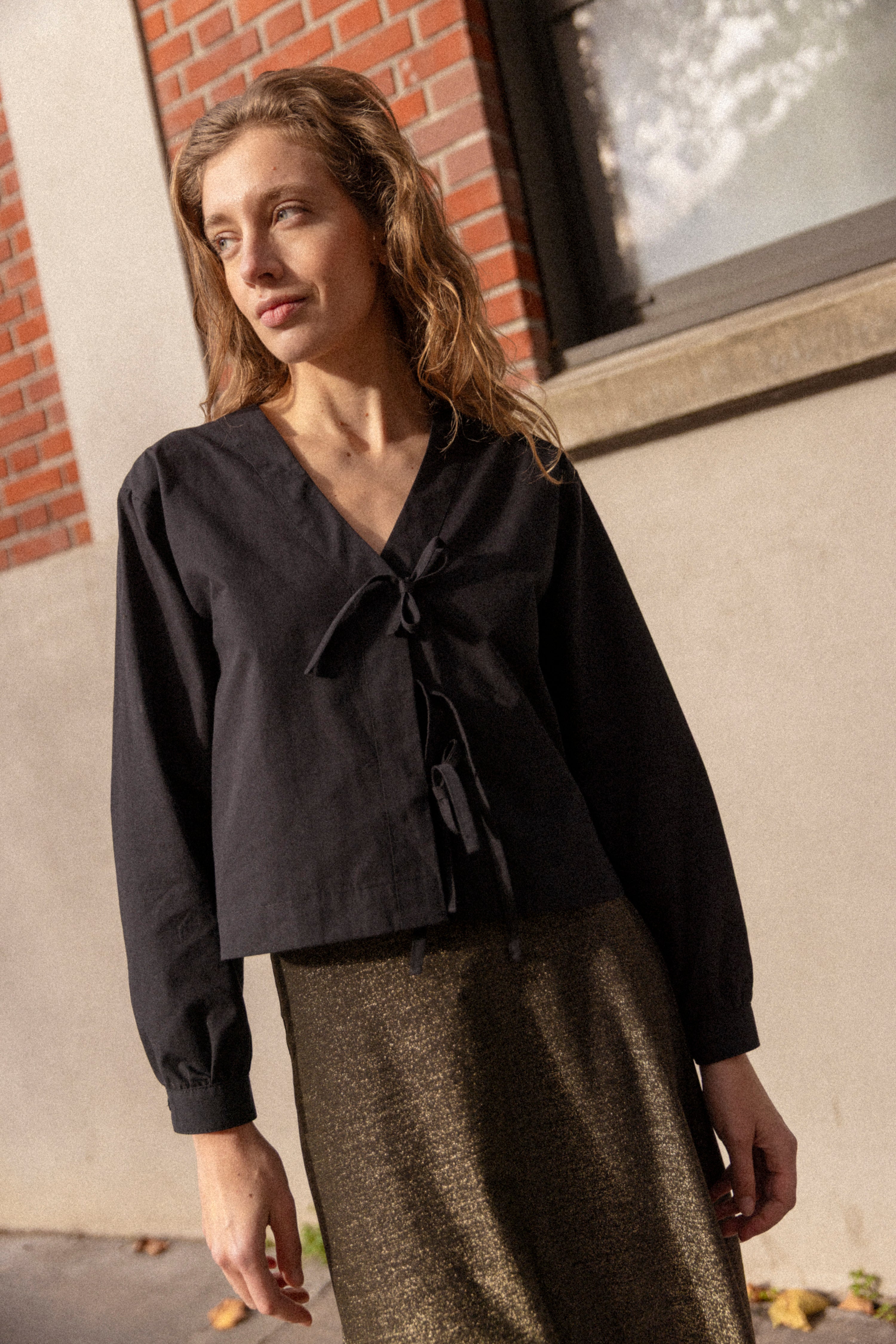 Black knotted blouse