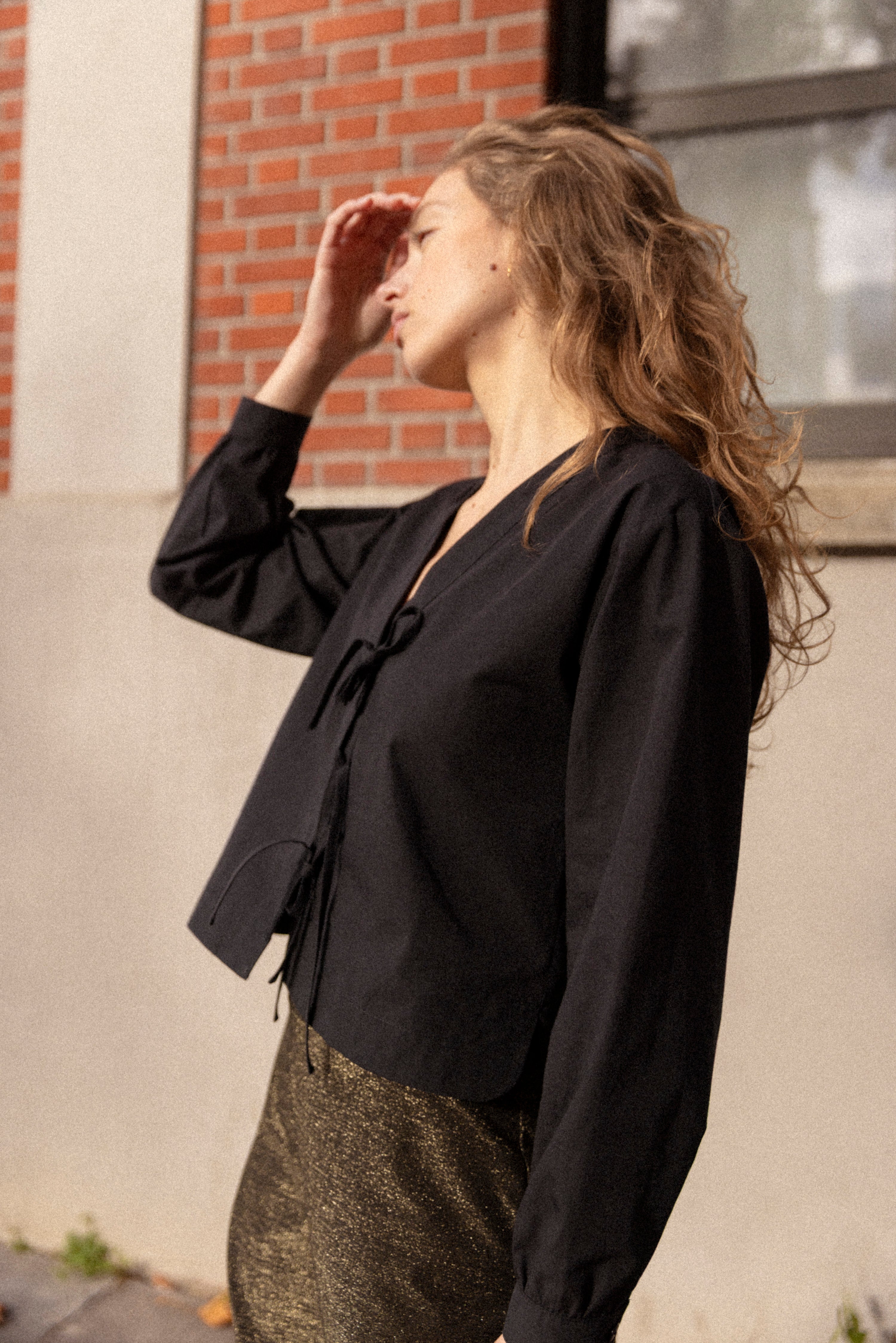 Black knotted blouse