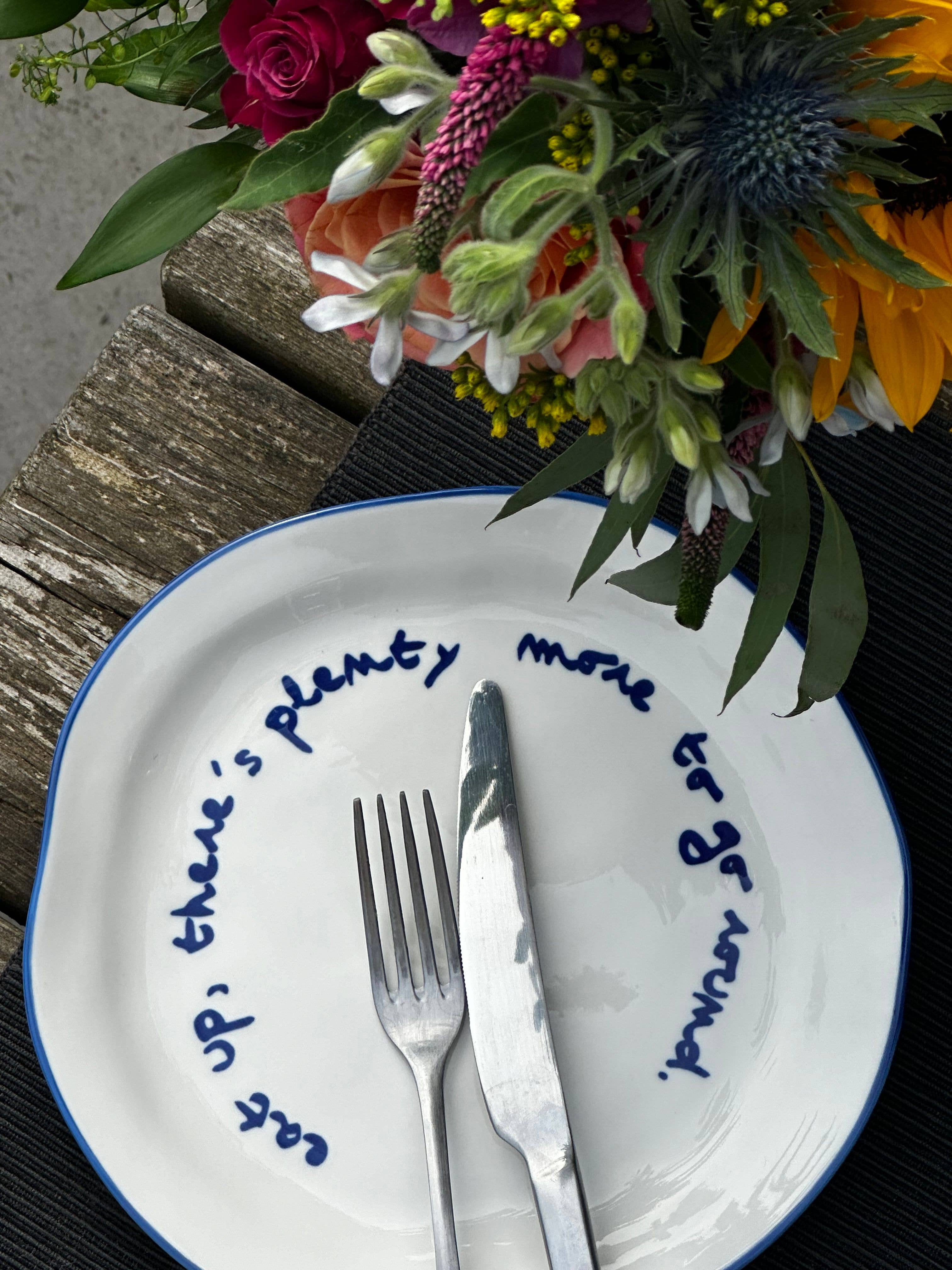 Plate with a message - "Eat, there's still plenty to share."